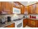 Kitchen featuring stainless steel appliances, granite countertops, and wooden cabinets at 142 Jaime Dr, Canton, GA 30114