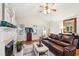 Comfortable living room with a fireplace, hardwood floors, and large windows at 142 Jaime Dr, Canton, GA 30114