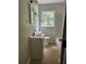 Bright bathroom with tiled floors, a large window, and a combined shower and tub at 4030 Hiram Ct, Powder Springs, GA 30127