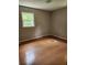 Bedroom featuring hardwood flooring, neutral-toned walls, and natural light at 4030 Hiram Ct, Powder Springs, GA 30127