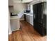 Updated kitchen featuring stainless steel refrigerator, new sink and faucet, and updated cabinetry at 4030 Hiram Ct, Powder Springs, GA 30127