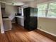 Updated kitchen featuring a stainless steel refrigerator, new sink and faucet, and plenty of cabinet space at 4030 Hiram Ct, Powder Springs, GA 30127