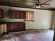 View of the kitchen showcasing a ceiling fan and wood cabinetry at 4030 Hiram Ct, Powder Springs, GA 30127