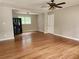 Open concept living room featuring hardwood floors, neutral paint, and plenty of natural light at 4030 Hiram Ct, Powder Springs, GA 30127