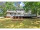 Home featuring a backyard with a large deck perfect for outdoor entertaining at 4261 Autumn Hill Dr, Stone Mountain, GA 30083