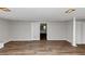 Finished basement area, freshly painted, with modern flooring, lots of open space, and a neutral color palette at 4261 Autumn Hill Dr, Stone Mountain, GA 30083