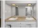 Bathroom double vanity with two sinks, granite countertops, and decorative mirrors at 4261 Autumn Hill Dr, Stone Mountain, GA 30083