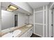 Bright bathroom featuring double sinks with granite countertops at 4261 Autumn Hill Dr, Stone Mountain, GA 30083