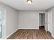 Bedroom features hardwood floors, light gray walls and closet access at 4261 Autumn Hill Dr, Stone Mountain, GA 30083