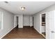 Bedroom with hardwood floors and two doors at 4261 Autumn Hill Dr, Stone Mountain, GA 30083