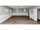 Spacious bonus room with hardwood floors and wainscotting detail at 4261 Autumn Hill Dr, Stone Mountain, GA 30083