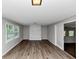Freshly painted Living room with modern floors, a white brick fireplace, and plenty of natural light at 4261 Autumn Hill Dr, Stone Mountain, GA 30083