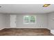 Bright, empty living room with hardwood floors, freshly painted walls, and natural light at 4261 Autumn Hill Dr, Stone Mountain, GA 30083