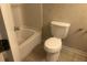 Bright bathroom with tile floors and a white tub-shower combination at 432 Rock Meadow Dr, Stone Mountain, GA 30088