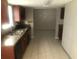 Kitchen featuring sleek black appliances, tiled floors, and a granite countertop at 432 Rock Meadow Dr, Stone Mountain, GA 30088