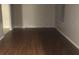 Empty living room showcasing modern wood flooring and neutral walls at 432 Rock Meadow Dr, Stone Mountain, GA 30088