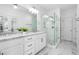 Bright bathroom with a glass shower, double sink vanity with granite countertop and white cabinets at 64 Emerson Hill Sq, Marietta, GA 30060