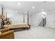 Spacious bedroom with sitting area, a canopy bed, and stairs to another level at 64 Emerson Hill Sq, Marietta, GA 30060