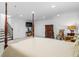 Spacious bedroom with sitting area, a canopy bed, and stairs to another level at 64 Emerson Hill Sq, Marietta, GA 30060