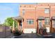 Charming brick townhouse with covered porch, stairs to the front door, and two car garage at 64 Emerson Hill Sq, Marietta, GA 30060