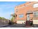 Charming brick townhouse with covered porch, stairs to the front door, and two car garage at 64 Emerson Hill Sq, Marietta, GA 30060