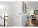 Upstairs hallway area with an elevator, paintings, and hardwood flooring at 64 Emerson Hill Sq, Marietta, GA 30060