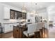 Open-concept kitchen with an island, modern appliances, and stylish pendant lighting at 64 Emerson Hill Sq, Marietta, GA 30060