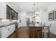 Modern kitchen featuring stainless appliances, granite countertops, and dark hardwood flooring at 64 Emerson Hill Sq, Marietta, GA 30060