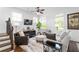 Spacious living room with natural light, hardwood floors, and a cozy seating arrangement at 64 Emerson Hill Sq, Marietta, GA 30060