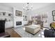 Bright living room with hardwood floors, fireplace, built-in shelving, and large windows at 64 Emerson Hill Sq, Marietta, GA 30060