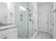 Bright bathroom with a glass shower with subway tile, built-in shelf and tiled floor at 64 Emerson Hill Sq, Marietta, GA 30060