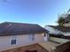 View of the backyard with deck, bench, and a partial view of the house's rear exterior at 11447 Vinea Ln, Hampton, GA 30228