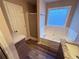 Bathroom with large bathtub, glass block window, and marble counter tops at 11447 Vinea Ln, Hampton, GA 30228