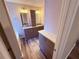 Bathroom with double marble vanity sinks and wood look floors at 11447 Vinea Ln, Hampton, GA 30228