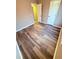 Bedroom with wood look floors, neutral colored walls, and white trim at 11447 Vinea Ln, Hampton, GA 30228