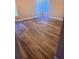 Inviting bedroom with hardwood floors, a corner window, and neutral decor at 11447 Vinea Ln, Hampton, GA 30228