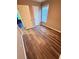 Bedroom with neutral colored walls, wood look floors, and a large window at 11447 Vinea Ln, Hampton, GA 30228
