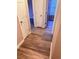 Hallway with wood look floors and neutral colored walls at 11447 Vinea Ln, Hampton, GA 30228