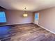 Open living room area showcasing new floors and contemporary lighting at 11447 Vinea Ln, Hampton, GA 30228