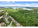 Stunning aerial view showcasing the neighborhood's lush landscape, nearby lake, and beautiful homes at 1286 Whisper Cove Dr, Buford, GA 30518