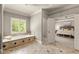 Bright bathroom featuring a soaking tub and an open view into the primary bedroom at 1286 Whisper Cove Dr, Buford, GA 30518