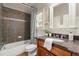 Bathroom showcasing vanity, tub, and elegant fixtures at 1286 Whisper Cove Dr, Buford, GA 30518