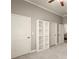 Bright bedroom featuring built-in shelving and white trim at 1286 Whisper Cove Dr, Buford, GA 30518