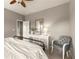 Bright bedroom featuring neutral paint, a ceiling fan and views to the bathroom and closet at 1286 Whisper Cove Dr, Buford, GA 30518