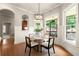 Inviting breakfast nook with outdoor views, perfect for enjoying morning coffee at 1286 Whisper Cove Dr, Buford, GA 30518