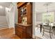 Dining room features a custom cabinet, hardwood floors, and neutral wall colors at 1286 Whisper Cove Dr, Buford, GA 30518