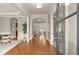 Grand foyer with hardwood floors, elegant trim, and views into the formal living spaces at 1286 Whisper Cove Dr, Buford, GA 30518