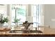 Granite kitchen island with stainless sink and faucet complemented by natural light and inviting decor at 1286 Whisper Cove Dr, Buford, GA 30518
