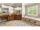 Elegant main bathroom with dual vanities, and a large soaking tub at 1286 Whisper Cove Dr, Buford, GA 30518