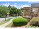 Neighborhood entrance featuring stone signage, landscaping and a pedestrian crossing at 1286 Whisper Cove Dr, Buford, GA 30518